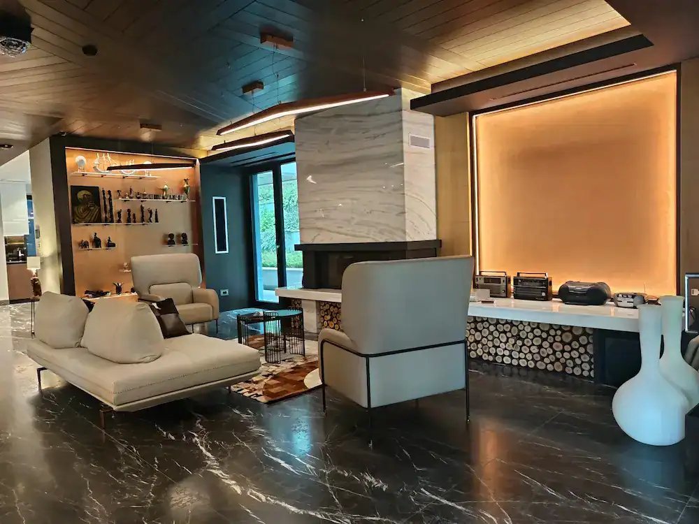 Modern Living Room Interior Luxurious modern living room interior with cozy sofas, stylish lighting, and marble floor.